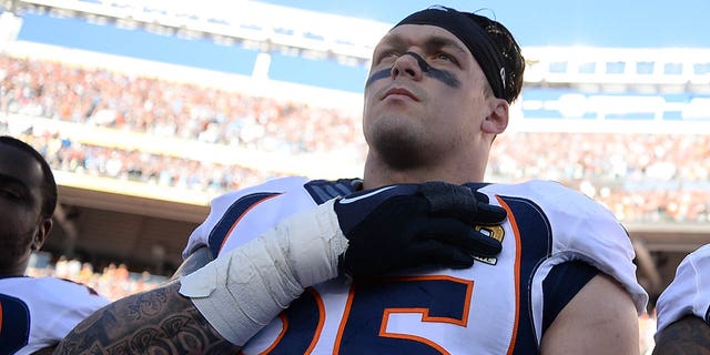 Derek Wolfe of the Denver Broncos stands on the sideline during the national anthem before the start of Super Bowl 50 against the Carolina Panthers at Levi's Stadium in Santa Clara, California on February 7, 2016.
