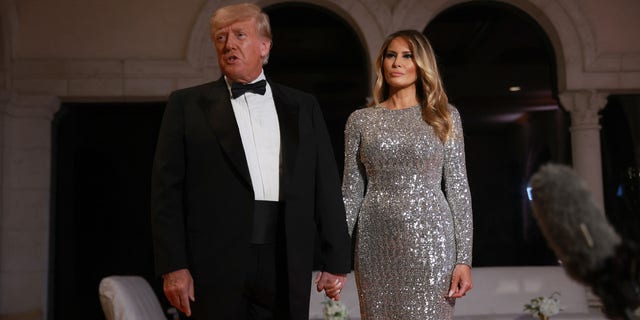 Former President Trump and former first lady Melania Trump arrive for a New Year's event at his Mar-a-Lago home Dec. 31, 2022, in Palm Beach, Fla.  