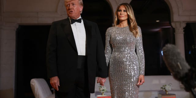 Former President Trump and former first lady Melania Trump arrive for a New Year's event at their Mar-a-Lago home Dec. 31, 2022, in Palm Beach, Fla.  