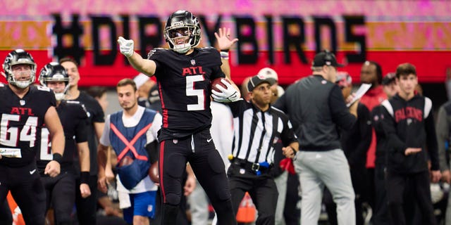 Drake London #5 of the Atlanta Falcons celebrates after a play against the Tampa Bay Buccaneers during the second half at Mercedes-Benz Stadium on January 8, 2023 in Atlanta, Georgia.