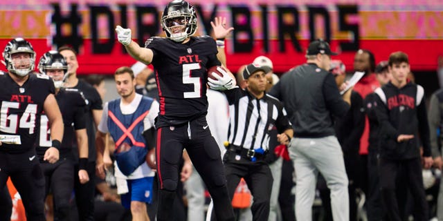 Drake London #5 of the Atlanta Falcons celebrates after a play against the Tampa Bay Buccaneers during the second half at Mercedes-Benz Stadium on January 8, 2023 in Atlanta, Georgia.