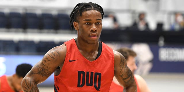 Jackie Johnson III #5 of the Duquesne Dukes looks on during a college basketball game against the George Washington Colonials at Smith Center on March 2, 2022 in Washington, DC. 