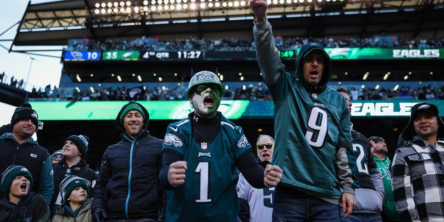 Philadelphia Eagles fans celebrate after a play during the second half of a game against the Tennessee Titans at Lincoln Financial Field Dec. 4, 2022, in Philadelphia.
