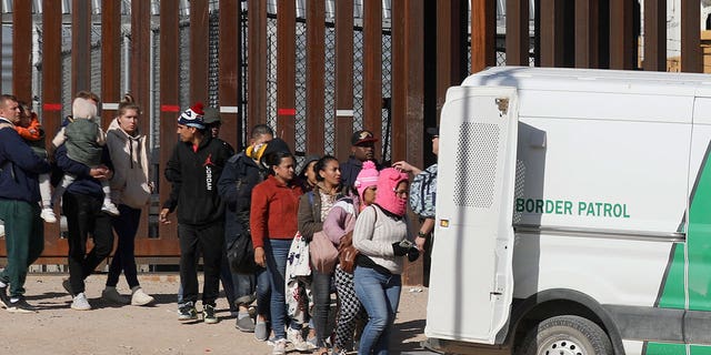 Venezuelan and Nicaraguan migrants are transferred by agents of the Border Patrol after crossing the Rio Grande to El Paso, Texas, Dec. 27, 2022.