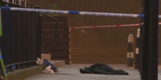 Metropolitan Police secure the scene after a drive by shooting wounded six including two children
