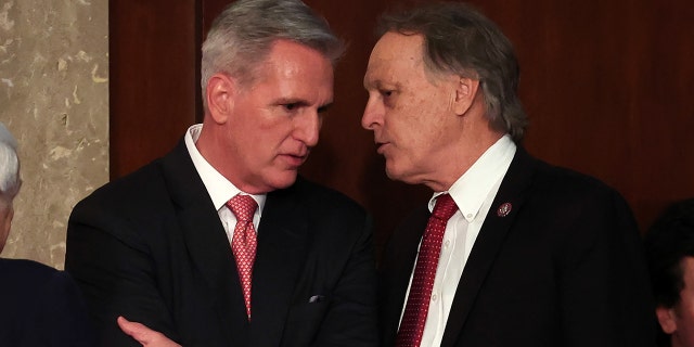 U.S. House Republican Leader Kevin McCarthy R-Calif., and Rep. Andy Biggs, R-Ariz., in the House Chamber at the U.S. Capitol Building on January 05, 2023, in Washington, DC.