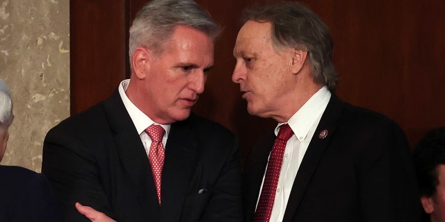 U.S. House Republican Leader Kevin McCarthy R-Calif., and Rep. Andy Biggs, R-Ariz., in the House Chamber at the U.S. Capitol Building on January 05, 2023, in Washington, DC. 