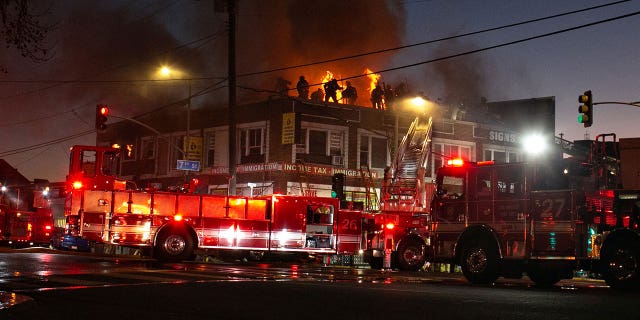 Firefighters battle fire inside a two-story apartment building in Westlake on Jan. 26, 2023, in Los Angeles, California.