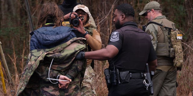 Four individuals were arrested on Wednesday morning near the site of the new police training facility. 