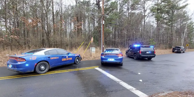 Police at the scene where a Georgia state trooper was shot on Wednesday, Jan. 18, 2023.