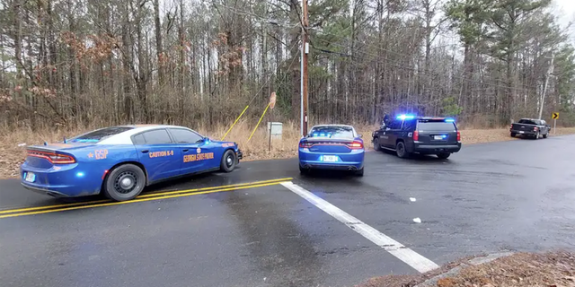 Police at the scene where a Georgia State Trooper was shot on Wednesday, Jan. 18, 2023.