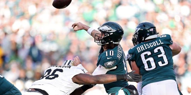 Gardner Minshew #10 of the Philadelphia Eagles passes under pressure from Carl Granderson #96 of the New Orleans Saints during the second half at Lincoln Financial Field on January 01, 2023 in Philadelphia, Pennsylvania.