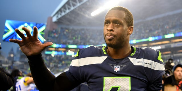 Geno Smith of the Seattle Seahawks celebrates after defeating the Los Angeles Rams in overtime at Lumen Field Jan. 8, 2023, in Seattle.