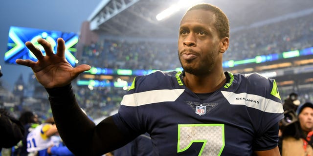 Geno Smith #7 of the Seattle Seahawks celebrates after defeating the Los Angeles Rams in overtime at Lumen Field on January 08, 2023 in Seattle, Washington.