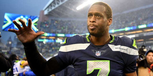 Geno Smith of the Seattle Seahawks celebrates after defeating the Los Angeles Rams in overtime at Lumen Field on January 8, 2023 in Seattle.