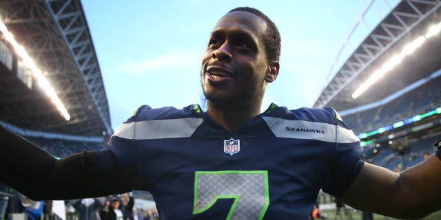 Geno Smith #7 of the Seattle Seahawks celebrates with fans after a win over the New York Jets at Lumen Field on January 1, 2023 in Seattle, Washington.