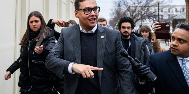 Rep. George Santos, R-N.Y., leaves a meeting of the House Republican Conference at the Capitol Hill Club.