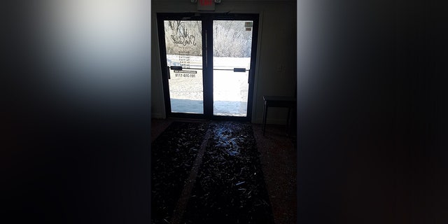 The invasive doe left a trail of shattered glass shards after it barged through the local Minnesota business.