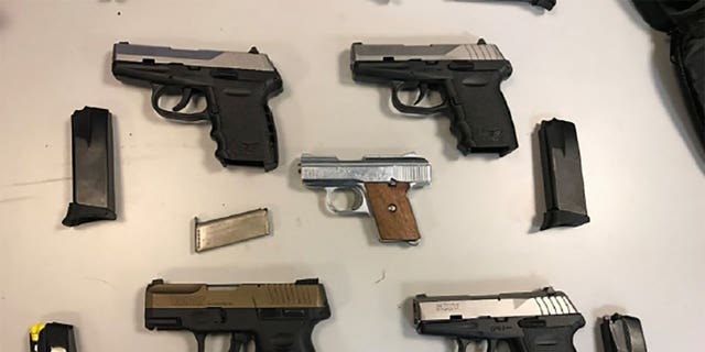 A federal indictment shows some of the more than 50 firearms that authorities say were illegally sold by the four defendants.