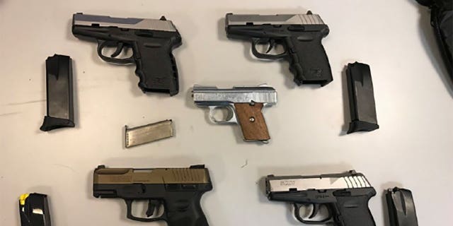 A federal indictment shows some of the more than 50 firearms that authorities say were illegally sold by the four defendants.