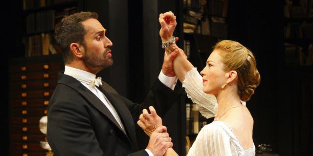 Rupert Everett (left) as Professor Henry Higgins and Honeysuckle Weeks as Liza Doolittle in George Bernard Shaw's Pygmalion at the Festival Theatre in Chichester, West Sussex.