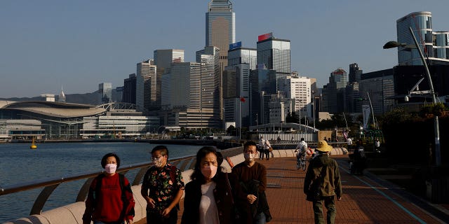 People wearing face masks on the streets of Hong Kong, China, on December 28, 2022.