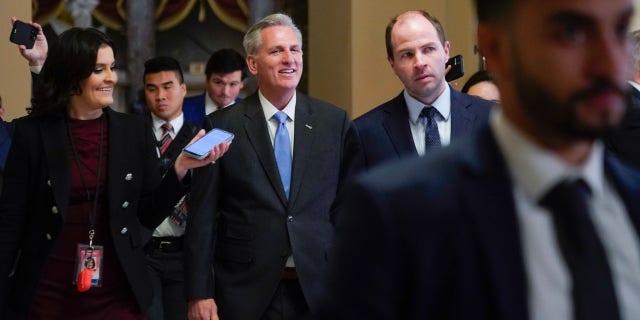 House Speaker Kevin McCarthy of Calif., speaks with members of the press as he walks to the House floor on Capitol Hill in Washington, Wednesday, Jan. 11, 2023.