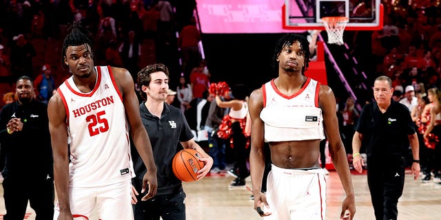 Jarace Walker #25 of the Houston Cougars and Tramon Mark #12 walk off the court after losing 56-55 to the Temple Owls at the Fertitta Center on January 22, 2023 in Houston, Texas.