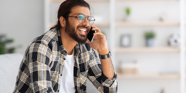 man smiling on phone