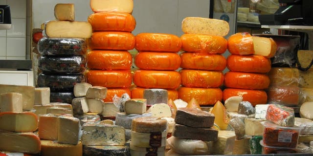 Wheels of various cheeses sits on a deli counter. Certain cheeses made in America’s Dairyland should be "fairly pleasing" in flavor.