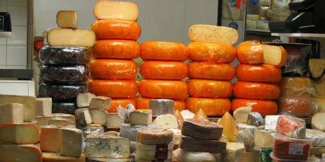 Wheels of various cheeses sits on a deli counter. Certain cheeses made in America’s Dairyland should be "fairly pleasing" in flavor.