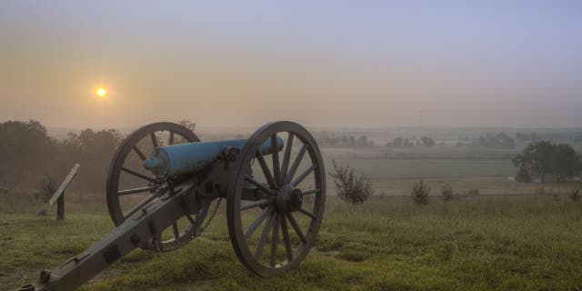 Dawn over the Gettysburg battlefield. In Pennsylvania, "it is a crime to serenade a wedding with guns or explosives," a document states.