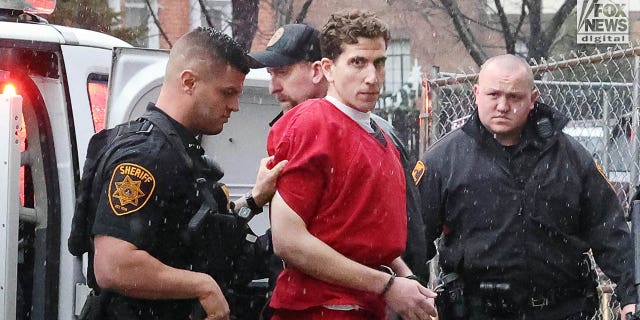 Kohberger wearing a red jail issue jumpsuit