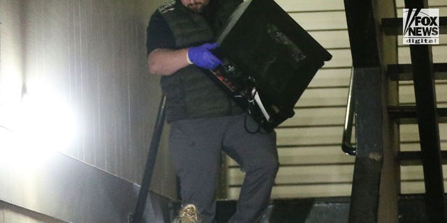 Investigators search Bryan Christopher Kohberger's home in Pullman, WA after dark on December 30, 2022. Among the items removed was the desktop computer, several boxes of evidence and multiple bags..