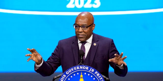 FILE - Illinois Attorney General Kwame Raoul delivers his remarks after being sworn to his second term as attorney general during ceremonies Monday, Jan. 9, 2023, in Springfield, Ill. Raoul on Monday, Jan. 23, 2023, asked a state appellate court to dismiss a temporary restraining order on Illinois' new ban on semiautomatic weapons adopted in response to a mass shooting at the July 4th parade in the Chicago suburb of Highland Park.