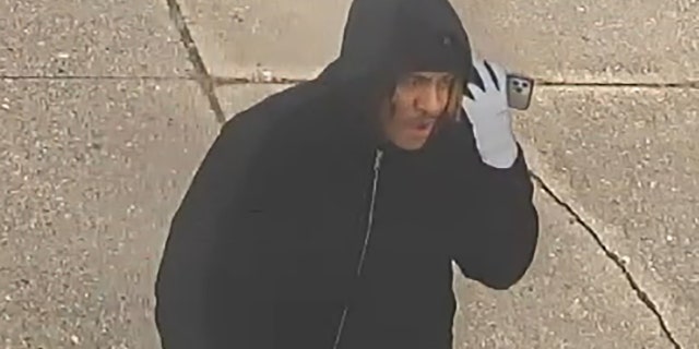 Police released surveillance footage of a suspect in the theft of a funeral home van containing a body on Saturday.