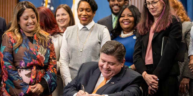 Democratic Illinois Gov. J.B. Pritzker signs a bill protecting out-of-state abortion seekers from legal penalty into law.