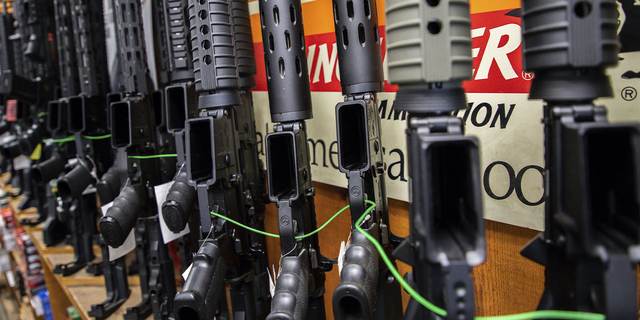 Several AR-15-style rifles are displayed at Freddie Bear Sports gun shop in Tinley Park, Illinois, on Aug. 8, 2019.