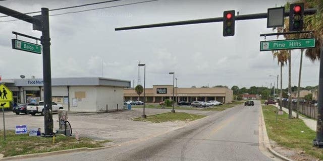 A Google Earth image shows the intersection of Belco Drive and North Pine Hills Road in Orange County, Fla.