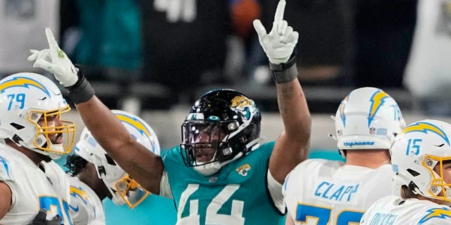 Jacksonville Jaguars linebacker Travon Walker (44) celebrates as Los Angeles Chargers place kicker Cameron Dicker (15) misses a field goal during the second of an NFL wild-card football game, Saturday, Jan. 14, 2023, in Jacksonville, Fla. 