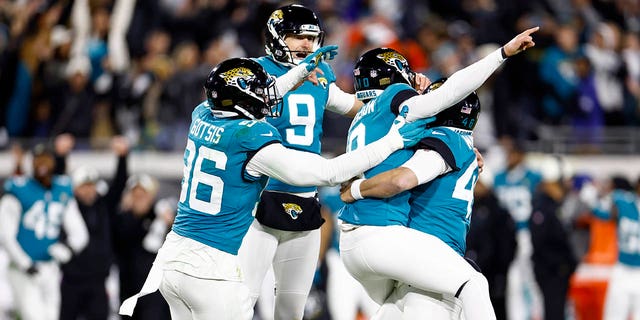 Riley Patterson #10 of the Jacksonville Jaguars celebrates with teammates after kicking a field goal to defeat the Los Angeles Chargers 31-30 in the AFC Wild Card playoff game at TIAA Bank Field on Jan. 14, 2023 in Jacksonville, Fla.