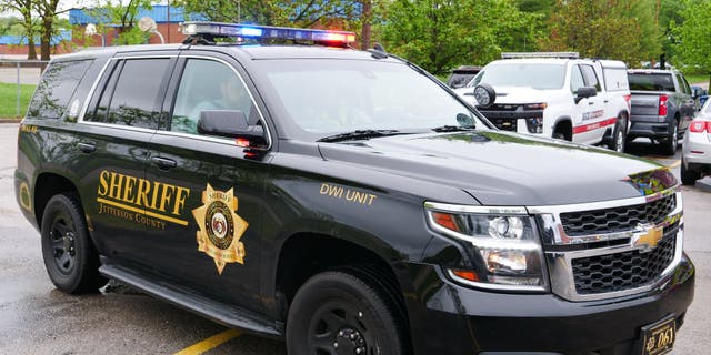 A DWI Unit patrol conveyance with the Jefferson County Sheriff's Office successful Missouri sits successful a parking lot.