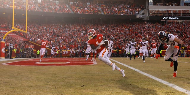 Jerick McKinnon #1 of the Kansas City Chiefs scores a touchdown during the fourth quarter in the game against the Denver Broncos at Arrowhead Stadium on January 01, 2023 in Kansas City, Missouri.