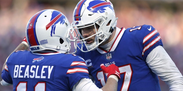 Buffalo Bills wide receiver Cole Beasley is congratulated by quarterback Josh Allen after his touchdown catch during the second half of an NFL wild-card playoff football game against the Miami Dolphins, Sunday, Jan. 15, 2023, in Orchard Park, New York.