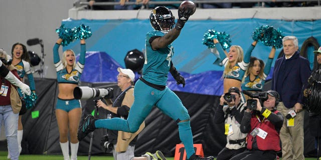 Jacksonville Jaguars linebacker Josh Allen (41) returns a fumble for a touchdown in the second half of an NFL football game against the Tennessee Titans, Saturday, Jan. 7, 2023, in Jacksonville, Fla.