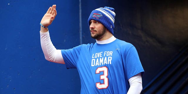 Quarterback Josh Allen, #17 of the Buffalo Bills, waves as he walks onto the field wearing a Damar Hamlin shirt prior to the game against the New England Patriots at Highmark Stadium on January 8, 2023, in Orchard Park, New York. 