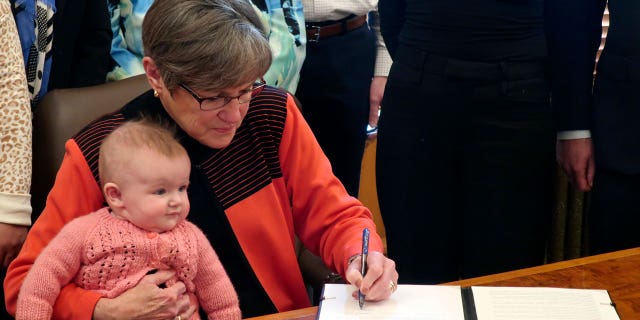 Kansas Gov. Laura Kelly's State of the State address has been postponed after the recently re-elected Democrat tested positive for COVID-19.