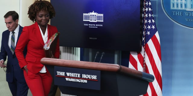 White House Press Secretary Karine Jean-Pierre and John Kirby arrive at a White House daily news briefing at the James S. Brady Press Briefing Room.