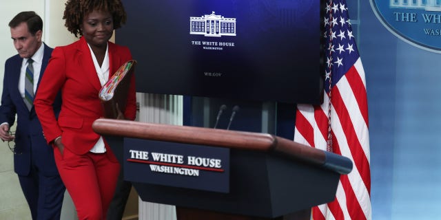 White House Press Secretary Karine Jean-Pierre and John Kirby arrive at a White House daily news briefing at the James S. Brady Press Briefing Room.