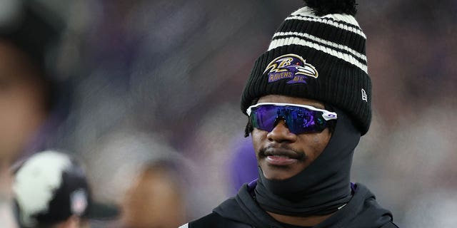 Quarterback Lamar Jackson of the Baltimore Ravens looks on from the sideline during a game against the Pittsburgh Steelers at M and T Bank Stadium Jan. 1, 2023, in Baltimore.